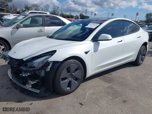 2023 Tesla Model 3 with VIN 5YJ3E1EA6PF488405, listed as a IAAI auction lot 41570896 with 26,631 mi miles. Bid and sale history available at carsss.com. Image 2.