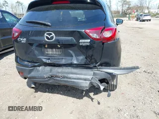 2016 Mazda CX-5 Grand Touring with VIN JM3KE4DY8G0639570, listed as a IAAI auction lot 42098512 with 126,541 mi miles and . Bid and sale history available at carsss.com. Image 6.