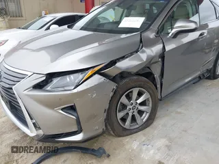 2018 Lexus RX 350 z VIN 2T2BZMCA3JC151296, wystawiony jako IAAI lot #41331203 z przebiegiem 73 051 mil mil oraz . Historia ofert i sprzedaży dostępna na DreamBid. Obrazek 6.