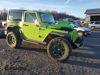 2013 Jeep Wrangler Rubicon 10th Anniversary with VIN 1C4BJWCG0DL506174, listed as a Copart auction lot 85300514 with 133,974 mi miles and Salvage Title. Bid and sale history available at DreamBid. Image 4.