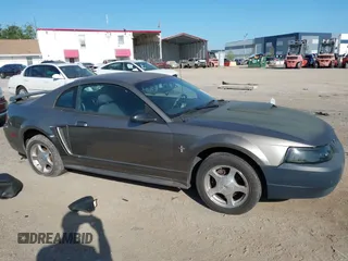 2001 Ford Mustang Standard with VIN 1FAFP40461F264327, listed as a IAAI auction lot 42002990 with 316,107 mi miles. Bid and sale history available at carsss.com. Image 12.