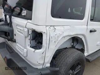 2023 Jeep Wrangler Sahara with VIN 1C4HJXEG5PW581632, listed as a IAAI auction lot 42462622 with 24,550 mi miles and . Bid and sale history available at DreamBid. Image 6.