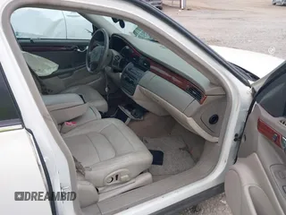 2005 Cadillac DeVille z VIN 1G6KD54Y75U162964, wystawiony jako IAAI lot #40794096 z przebiegiem 165 341 mil mil oraz . Historia ofert i sprzedaży dostępna na DreamBid. Obrazek 5.