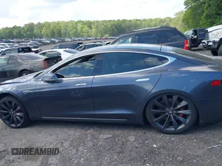 2014 Tesla Model S P85D with VIN 5YJSA1H29EFP63032, listed as a IAAI auction lot 42132145 with Not Provided miles and . Bid and sale history available at DreamBid. Image 13.