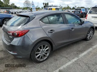 2018 Mazda 3 Touring z VIN 3MZBN1L38JM219466, wystawiony jako Copart lot #56766025 z przebiegiem 124 775 mil mil oraz Szkoda całkowita • Salvage title. Historia ofert i sprzedaży dostępna na DreamBid. Obrazek 3.