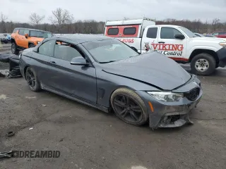 2015 BMW 4 Series 435i xDrive with VIN WBA3T7C56FP942328, listed as a Copart auction lot 52410695 with Not provided miles and Salvage title. Bid and sale history available at DreamBid. Image 4.
