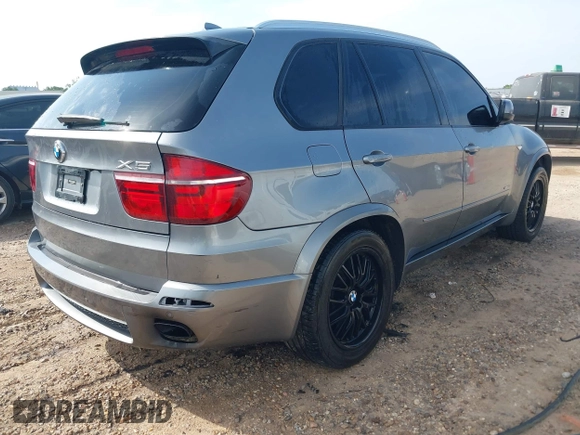 2012 BMW X5 50i with VIN 5UXZV8C56CL426081, listed as a IAAI auction lot 42084071 with 135,473 mi miles and . Bid and sale history available at DreamBid. Image 4.