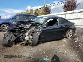2016 BMW 2 Series M235i xDrive with VIN WBA1J9C52GV695802, listed as a Copart auction lot 74511304 with 0 mi miles and Salvage Title. Bid and sale history available at carsss.com. Image 1.