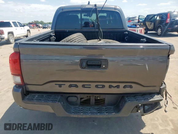 2021 Toyota Tacoma SR with VIN 3TYAX5GN8MT018185, listed as a Copart auction lot 59977895 with 68,149 mi miles and Salvage title. Bid and sale history available at DreamBid. Image 6.
