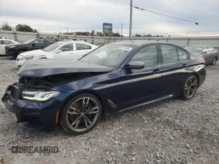2021 BMW 5 Series M550i xDrive z VIN WBA13BK03MCF92308, wystawiony jako Copart lot #84511864 z przebiegiem 21 990 mil mil oraz Szkoda całkowita • Salvage title. Historia ofert i sprzedaży dostępna na DreamBid. Obrazek 1.