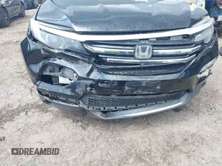 2017 Honda Pilot Touring with VIN 5FNYF5H99HB037126, listed as a IAAI auction lot 42275048 with 164,289 mi miles and . Bid and sale history available at DreamBid. Image 6.
