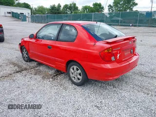 2003 Hyundai Accent GL z VIN KMHCG35CX3U247788, wystawiony jako IAAI lot #42254692 z przebiegiem 89 560 mil mil oraz . Historia ofert i sprzedaży dostępna na DreamBid. Obrazek 3.