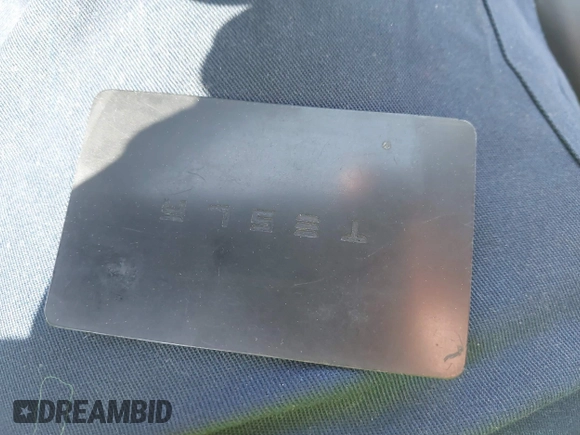 2020 Tesla Model 3 Standard Range Plus with VIN 5YJ3E1EA7LF797150, listed as a IAAI auction lot 41869088 with 75,708 mi miles and . Bid and sale history available at carsss.com. Image 11.