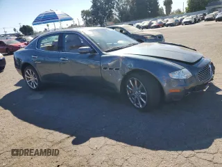 2006 Maserati Quattroporte z VIN ZAMCE39A960023356, wystawiony jako Copart lot #76954384 z przebiegiem 76 185 mil mil oraz Szkody całkowita. Historia ofert i sprzedaży dostępna na DreamBid. Obrazek 4.