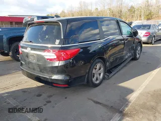 2019 Honda Odyssey EX-L with VIN 5FNRL6H74KB061567, listed as a IAAI auction lot 41810919 with 129,146 mi miles. Bid and sale history available at carsss.com. Image 4.