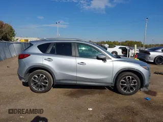 2016 Mazda CX-5 Grand Touring z VIN JM3KE2DY3G0712249, wystawiony jako IAAI lot #37910910 z przebiegiem 262 058 mil mil oraz . Historia ofert i sprzedaży dostępna na DreamBid. Obrazek 13.