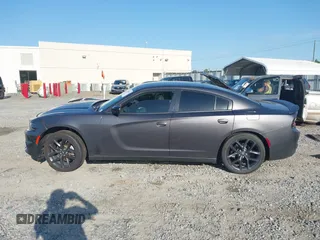 2021 Dodge Charger SXT z VIN 2C3CDXBGXMH659892, wystawiony jako IAAI lot #42011248 z przebiegiem 58 005 mil mil oraz . Historia ofert i sprzedaży dostępna na DreamBid. Obrazek 15.