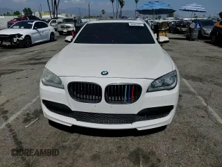 2013 BMW 7 Series 750i with VIN WBAYA8C54DC996412, listed as a Copart auction lot 56982895 with 124,258 mi miles and Salvage title. Bid and sale history available at DreamBid. Image 13.