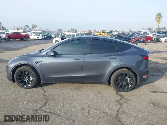 2023 Tesla Model Y Long Range with VIN 7SAYGDEE7PA196038, listed as a IAAI auction lot 41459601 with 16,489 mi miles and . Bid and sale history available at DreamBid. Image 14.