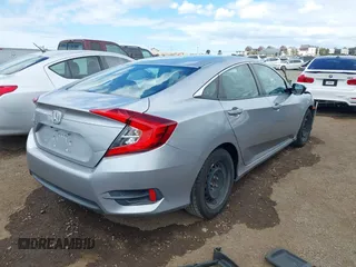 2018 Honda Civic LX with VIN 2HGFC2F50JH500559, listed as a IAAI auction lot 42040271 with 82,026 mi miles and . Bid and sale history available at DreamBid. Image 4.