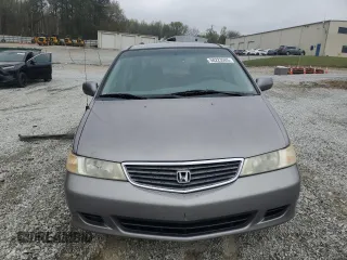 2000 Honda Odyssey EX with VIN 2HKRL1865YH513885, listed as a Copart auction lot 50223505 with 214,627 mi miles and Salvage Title. Bid and sale history available at DreamBid. Image 5.