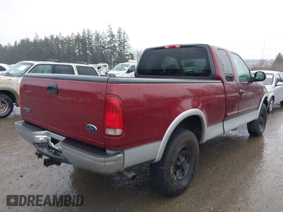 1999 Ford F-150 XL with VIN 2FTRX18L1XCA54790, listed as a IAAI auction lot 41556984 with 257,673 mi miles. Bid and sale history available at carsss.com. Image 4.