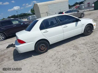 2002 Mitsubishi Lancer ES with VIN JA3AJ26E42U054430, listed as a IAAI auction lot 41918246 with 192,996 mi miles. Bid and sale history available at carsss.com. Image 4.