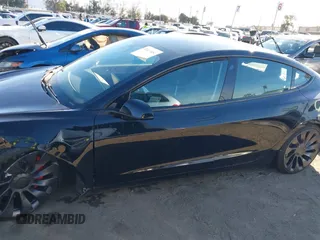 2021 Tesla Model 3 Performance with VIN 5YJ3E1EC6MF999321, listed as a IAAI auction lot 41417451 with 20,562 mi miles and . Bid and sale history available at carsss.com. Image 14.