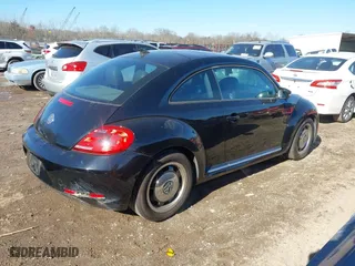 2012 Volkswagen Beetle 2.5L w/Sun/Sound/Nav PZEV with VIN 3VWHP7AT1CM652074, listed as a IAAI auction lot 41374829 with 1 mi miles. Bid and sale history available at carsss.com. Image 4.