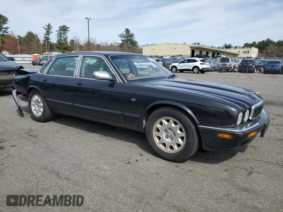 2002 Jaguar XJ 8 with VIN SAJDA14C62LF40435, listed as a Copart auction lot 52022645 with 153,703 mi miles and Salvage title. Bid and sale history available at DreamBid. Image 4.