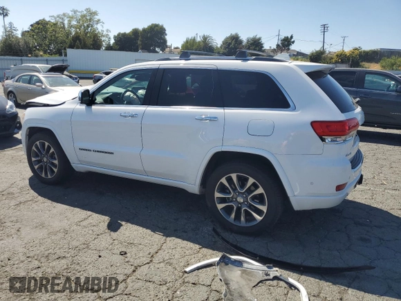 2017 Jeep Grand Cherokee Overland with VIN 1C4RJFCT5HC777748, listed as a Copart auction lot 63121635 with 106,991 mi miles and Salvage title. Bid and sale history available at DreamBid. Image 2.