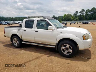 2001 Nissan Frontier SE z VIN 1N6ED27T21C305986, wystawiony jako Copart lot #59665065 z przebiegiem 201 540 mil mil oraz Czysty tytuł • Clean title. Historia ofert i sprzedaży dostępna na DreamBid. Obrazek 4.