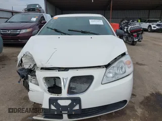 2006 Pontiac G6 6-Cyl z VIN 1G2ZG558364124834, wystawiony jako IAAI lot #41815411 z przebiegiem Nie podano mil oraz . Historia ofert i sprzedaży dostępna na DreamBid. Obrazek 11.