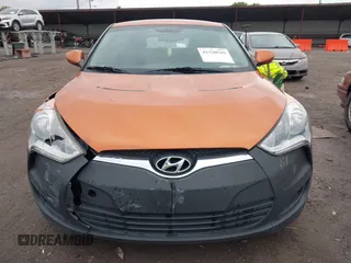 2012 Hyundai Veloster w/Gray Int with VIN KMHTC6AD3CU057620, listed as a IAAI auction lot 42320549 with 113,491 mi miles and . Bid and sale history available at DreamBid. Image 12.