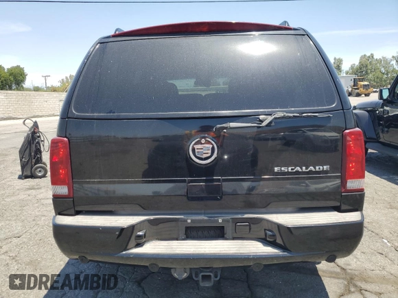 2002 Cadillac Escalade z VIN 1GYEC63T42R189976, wystawiony jako Copart lot #57852565 z przebiegiem 243 089 mil mil oraz Szkody całkowita. Historia ofert i sprzedaży dostępna na DreamBid. Obrazek 6.