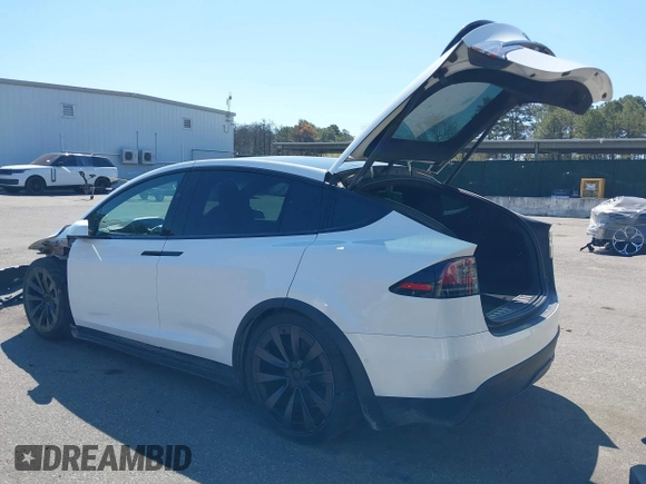 2022 Tesla Model X with VIN 7SAXCDE58NF342776, listed as a IAAI auction lot 42042369 with 70,301 mi miles and . Bid and sale history available at DreamBid. Image 3.