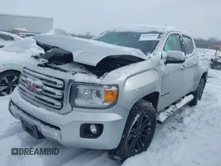2015 GMC Canyon 4WD SLT with VIN 1GTG6CE36F1257975, listed as a IAAI auction lot 41607688 with 127,523 mi miles. Bid and sale history available at carsss.com. Image 2.