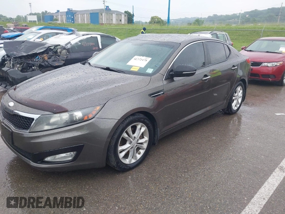 2013 Kia Optima EX z VIN 5XXGN4A79DG181719, wystawiony jako IAAI lot #42372478 z przebiegiem 166 410 mil mil oraz . Historia ofert i sprzedaży dostępna na DreamBid. Obrazek 17.