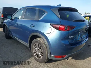 2021 Mazda CX-5 Touring with VIN JM3KFACM5M0332718, listed as a IAAI auction lot 41905933 with 30,930 mi miles. Bid and sale history available at carsss.com. Image 3.