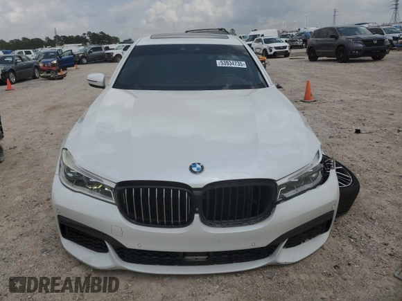 2019 BMW 7 Series 750i с VIN WBA7F0C52KGM24906, выставлен на аукционе Copart как лот 53934735 с пробегом 96 247 миль миль и Списание • Salvage title. История ставок и продаж доступна на DreamBid. Изображение 5.