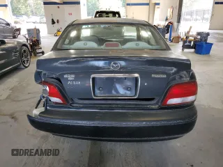1998 Mazda 626 DX with VIN 1YVGF22C2W5751008, listed as a Copart auction lot 74742174 with 172,980 mi miles and Salvage Title. Bid and sale history available at carsss.com. Image 6.