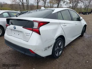 2021 Toyota Prius L Eco with VIN JTDKAMFUXM3137233, listed as a IAAI auction lot 40870395 with 60,000 mi miles. Bid and sale history available at carsss.com. Image 4.