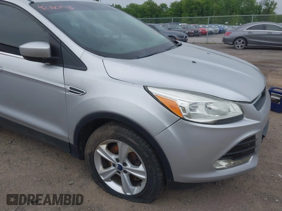 2014 Ford Escape SE z VIN 1FMCU9GX9EUC35713, wystawiony jako IAAI lot #42323161 z przebiegiem 169 393 mil mil oraz . Historia ofert i sprzedaży dostępna na DreamBid. Obrazek 6.