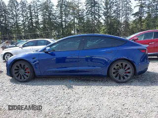 2021 Tesla Model 3 Performance with VIN 5YJ3E1EC1MF000961, listed as a IAAI auction lot 42110524 with 31,890 mi miles and . Bid and sale history available at carsss.com. Image 14.