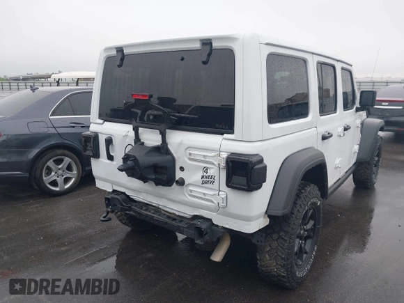 2023 Jeep Wrangler Sport with VIN 1C4HJXDN8PW523532, listed as a IAAI auction lot 41962483 with 14,643 mi miles and . Bid and sale history available at DreamBid. Image 4.