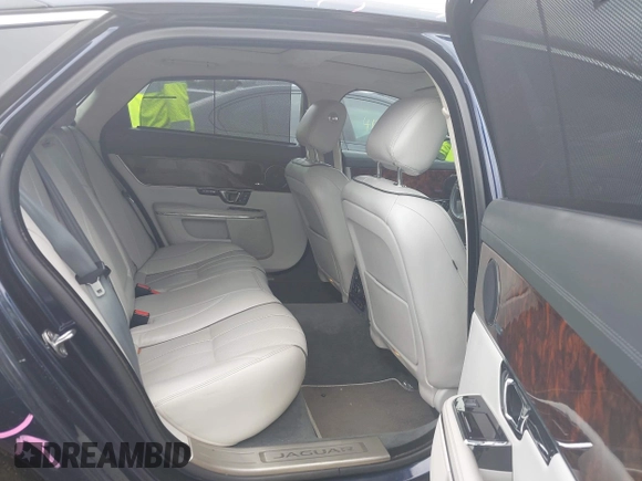 2015 Jaguar XJ Portfolio with VIN SAJWJ2GD0F8V83497, listed as a IAAI auction lot 41697285 with 52,311 mi miles and . Bid and sale history available at DreamBid. Image 8.