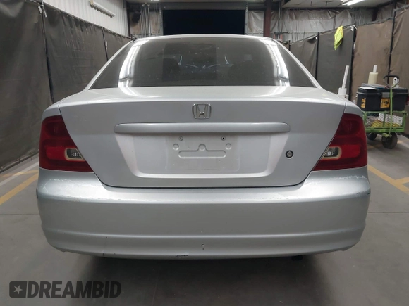 2003 Honda Civic LX with VIN 1HGEM22573L012729, listed as a IAAI auction lot 42041772 with 157,207 mi miles. Bid and sale history available at carsss.com. Image 16.