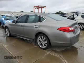 2012 Infiniti M37 with VIN JN1BY1AP9CM333056, listed as a Copart auction lot 74810944 with 212,631 mi miles and Salvage Title. Bid and sale history available at carsss.com. Image 2.