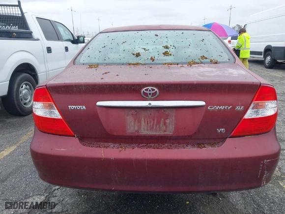 2004 Toyota Camry LE with VIN 4T1BF32K54U069705, listed as a IAAI auction lot 41809582 with 194,606 mi miles. Bid and sale history available at carsss.com. Image 13.