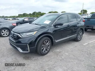 2021 Honda CR-V Touring with VIN 2HKRW1H91MH410751, listed as a IAAI auction lot 41286168 with 56,314 mi miles. Bid and sale history available at carsss.com. Image 2.